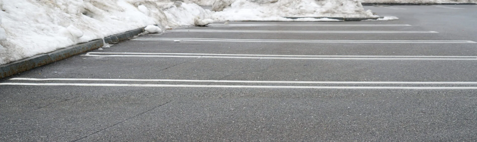 snow and ice removed from parking lot spaces