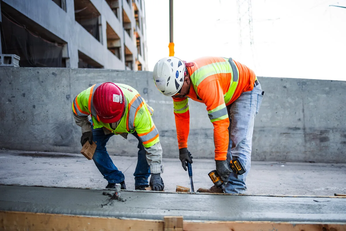 two pave america employees working on a concrete project