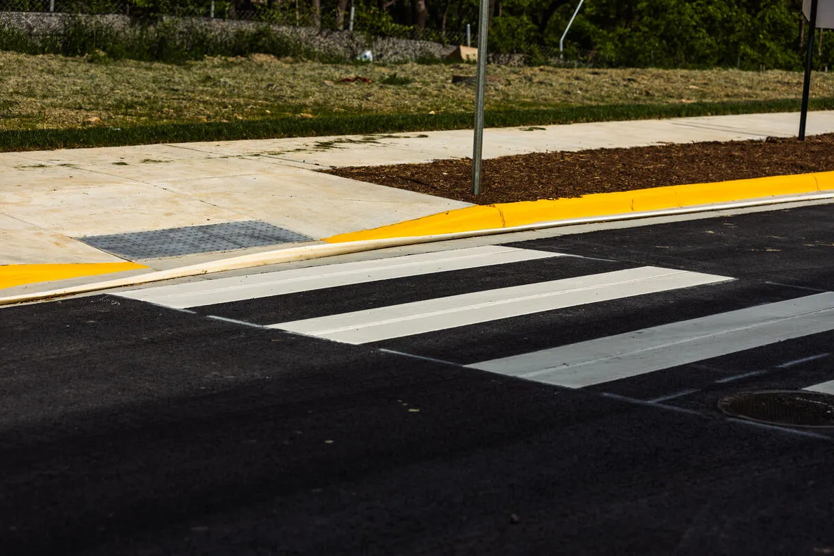 newly paved and painted pedestrian crosswalk