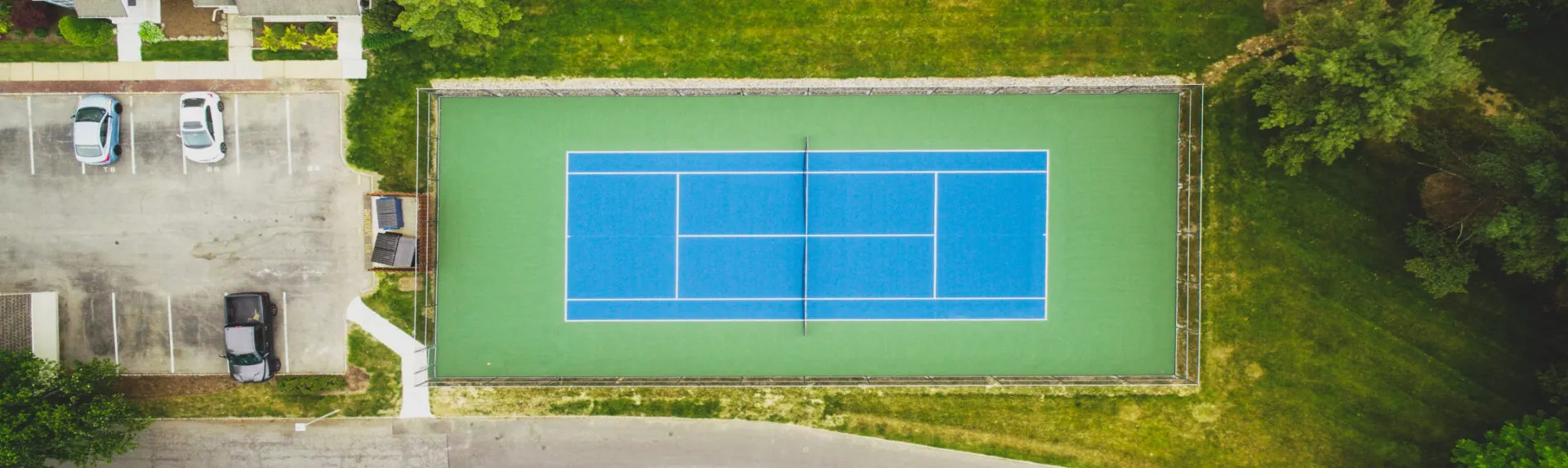 aerial view of a blue and green tennis court
